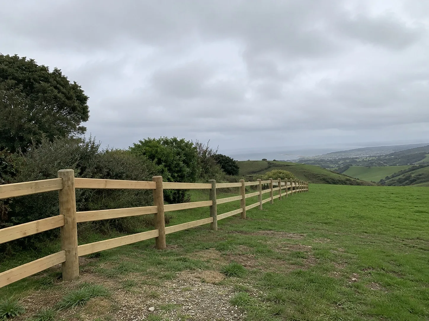 Post and rail fence on a Wellington lifestyle block at sunset
