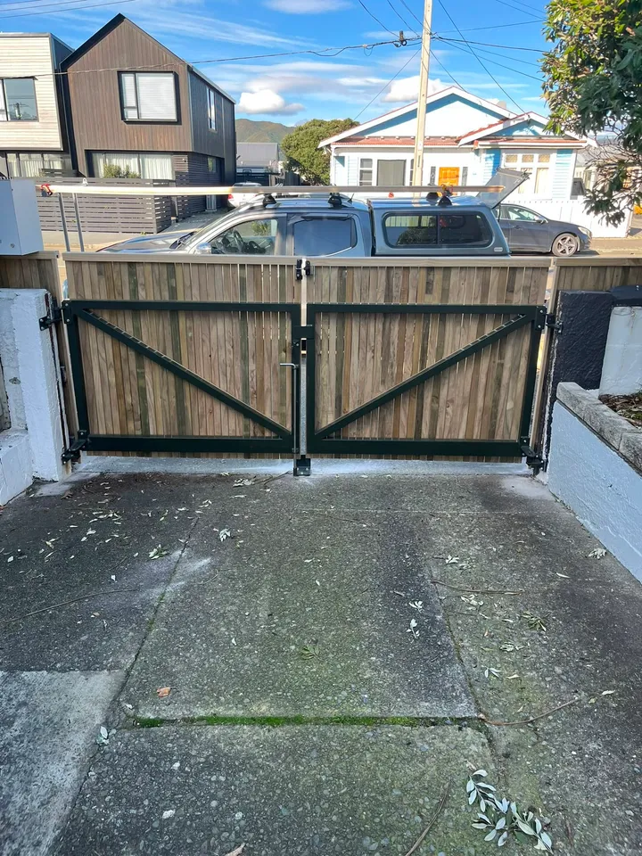 Timber double driveway gate with a steel frame in Wellington